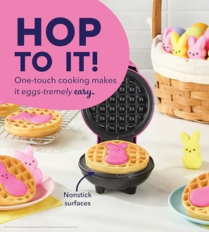 A pink mini waffle maker featuring the iconic PEEPS® bunny shape, perfect for making festive Easter