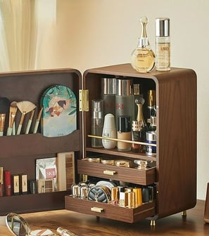 a small cabinet with a mirror and a mirror