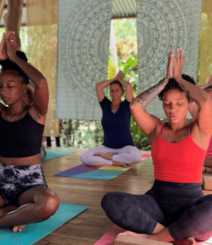 a group of people doing yoga poses