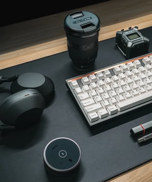 a keyboard and a laptop computer sitting on a desk