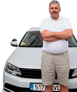a man standing in front of a car with his arms crossed and his arms crossed