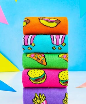 a stack of colorful socks with a colorful pattern
