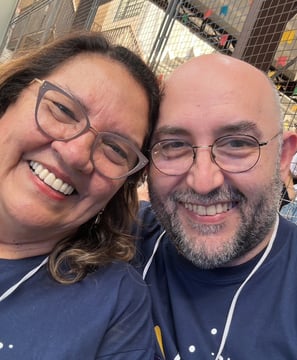 a man and woman smiling and posing for a picture