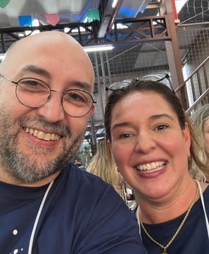 a man and woman smiling and posing for a photo