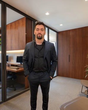 a man in a suit and tie standing in a room