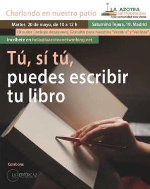 a person holding a pen and writing on a book