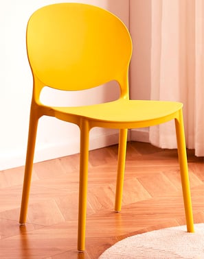 3D Renders of modern plastic chair set in a cozy, bright room with a wooden table, soft tones