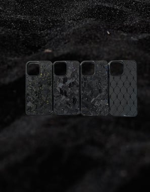 a group of four cell phones with a black background