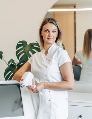 a woman in white shirt and white shirt holding a hair dryer