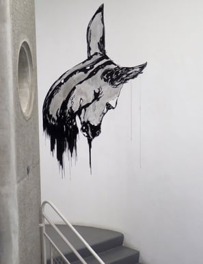 a wall mural of a horse head with a horse head