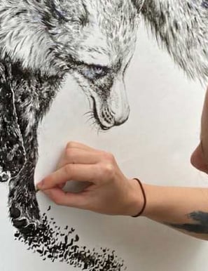 a woman is drawing a wolf in a drawing painting