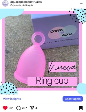 a pink cupcake with a pink cupcake on top of it