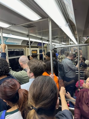 A subway car full of people