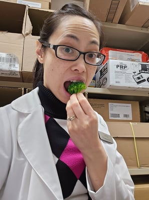 Pharmacist Linda eating broccoli