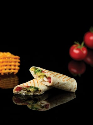 Chicken vegetable lavash shawarma cut into two pieces