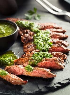 skirt steak sliced served with chimi churri