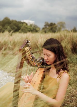 Photoshoot at Jurong Lake Park with an Aoyama lap harp, which is often used in ensemble performances