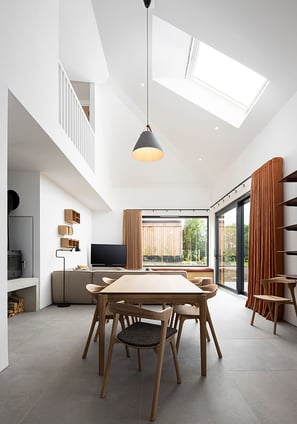 a dining room with a table and chairs