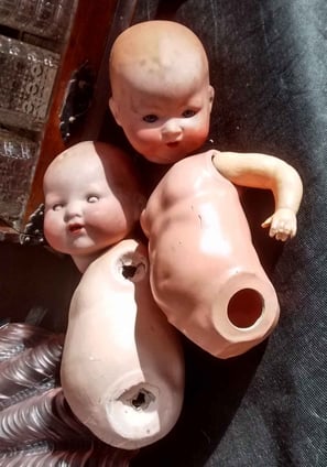 Photograph taken by the Chester UK Artist, Christine Gallagher showing 2 broken dolls