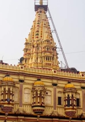a large building with a tower with a clock on it