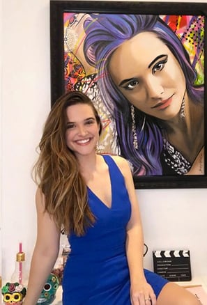 Contemporary pop-art works adorn the gallery walls.