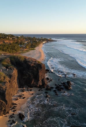 a beach with a view of the ocean and a beach