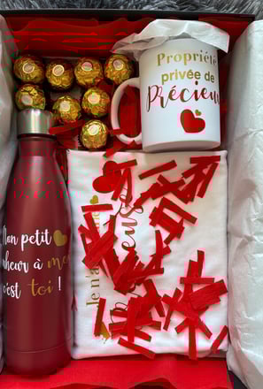 a coffee mug with a mug and chocolates