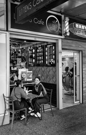 Peter Pickering' captures two girls having coffee outside a Perth cafe