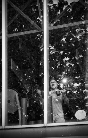 Man strenuously working out in the gym. A moment immortalised by photographer Peter Pickering