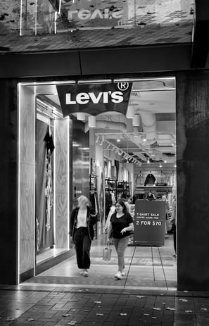 Two female shoppers leaving a Levi's store captured by photographer Peter Pickering