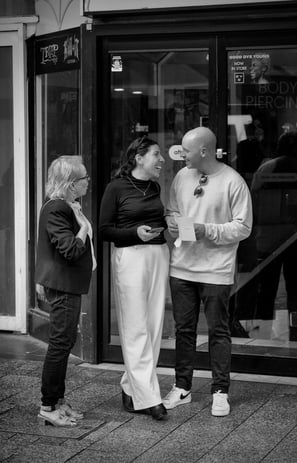 People chatting on the street captured by photographer Peter Pickering