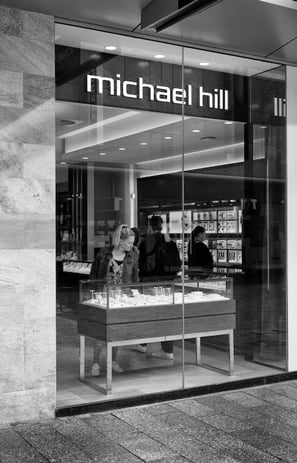 A woman in a jewellery store by the lens of Peter Pickering