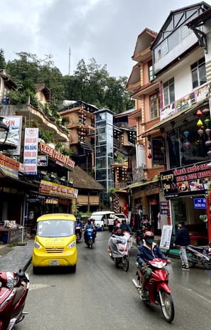 a yellow taxi cab driving down a street