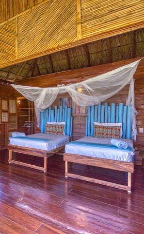 twin beds in wooden bungalow retreat center