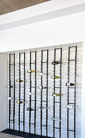 a wall of glasses with a bunch of glasses on it