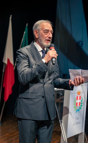 Man speaking at a cigar event planned by Francesco Margaretini Luxury Travel Villas & Weddings