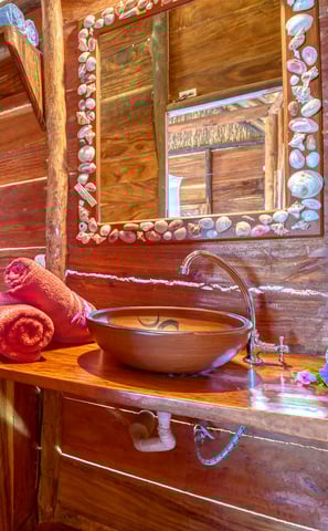 bathroom in wooden bungalow retreat center central america