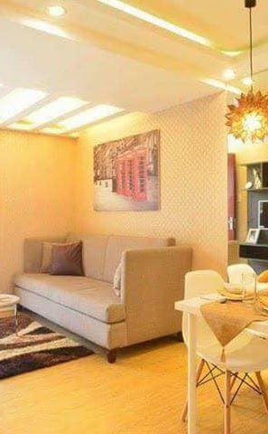 a living room with a couch and a television