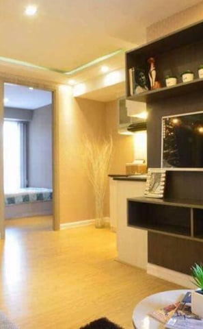 a living room with a couch and a television