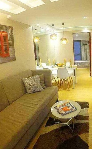 a living room with a couch and a television