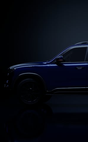 a blue suv with a black background and a black background