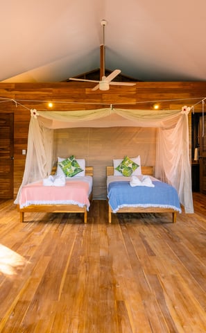twin beds in wooden bungalow retreat center