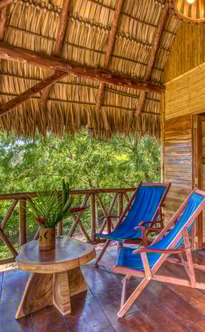 terrace on wooden bungalow in the middle of the garden