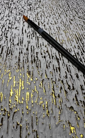 Textured plaster with gold leaf detailing