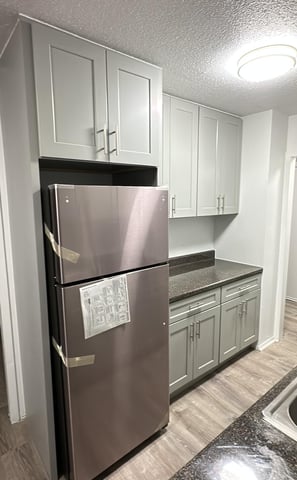 a refrigerator with a refrigerator and a refrigerator freezer