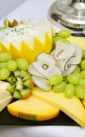assorted cheese platter on catering dish