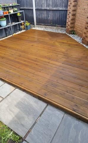 a wooden deck with a wooden decking area