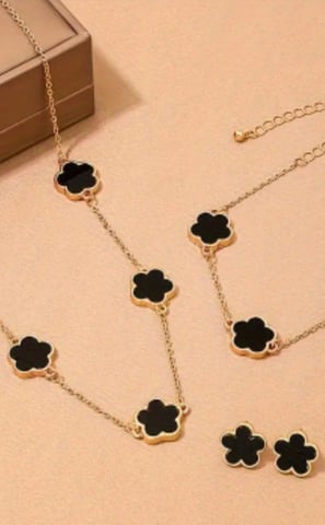 a necklace with a black clover clover clover necklace