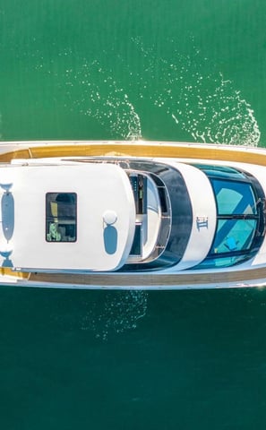a boat with a large white boat in the water