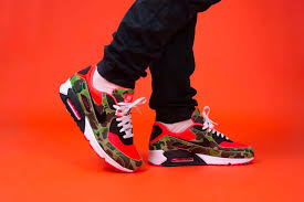 Nike Air Max 90 SP 'Reverse Duck Camo' (2020) sneaker in brown camo print with orange accents and retro trail-inspired design